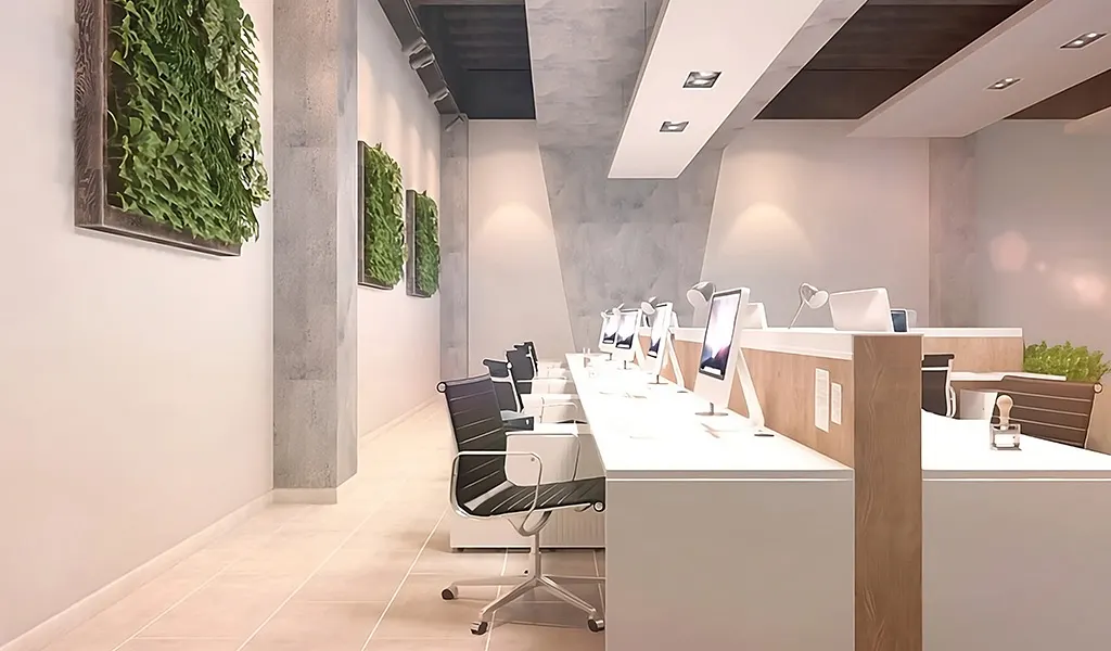 Oficina iluminada con varios computadores alta gama